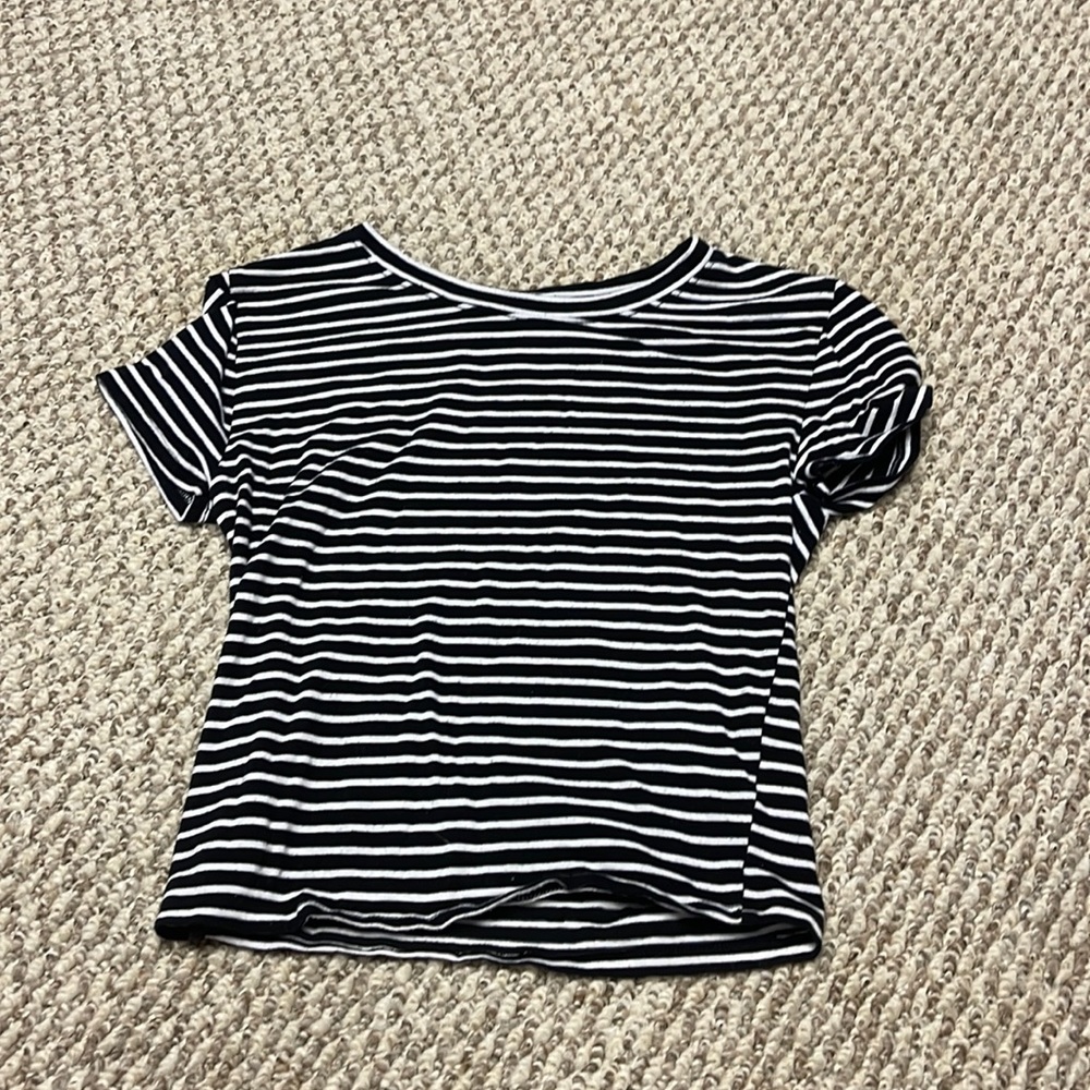 Black and white striped crop top. It shows large, but it fits more like a small.